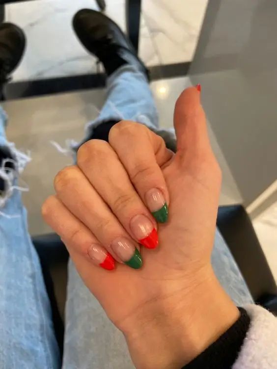 Bold and Playful French Manicure with Vibrant Red and Green Tips.