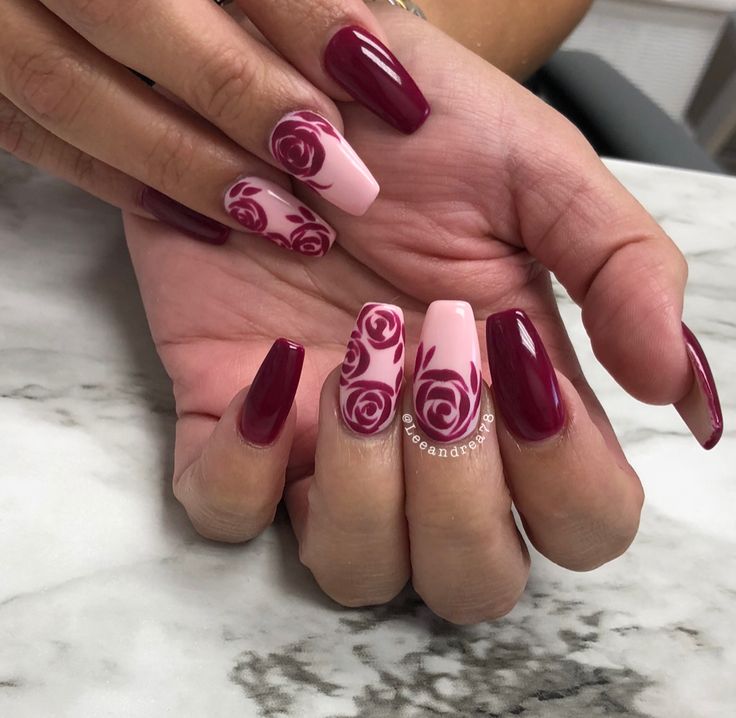 Romantic Deep Maroon and Soft Pink Nail Design with Intricate Rose Patterns.