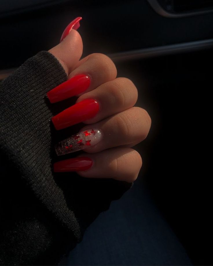 Chic Red Nail Design with Glamorous Gold Glitter Accent.