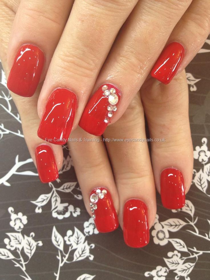 Elegant Bold Red Nail Design with Glossy Finish and Rhinestone Accents