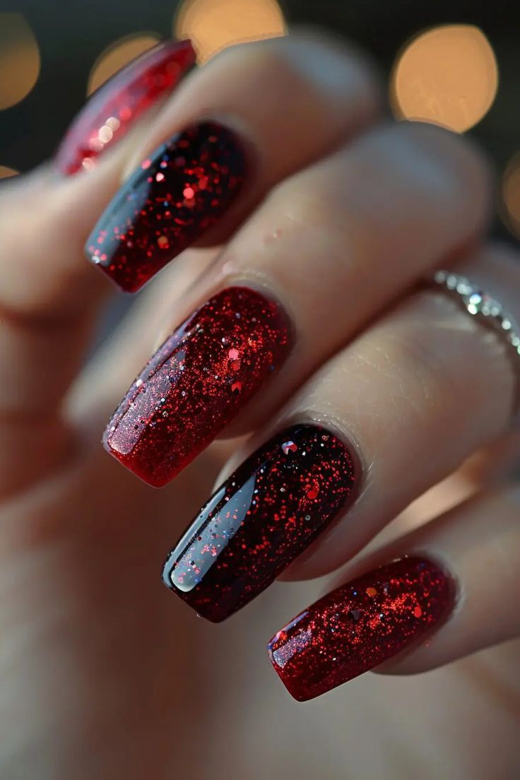 Bold Ombre Glitter Nails: Striking Red to Black Transition with Sparkling Accents