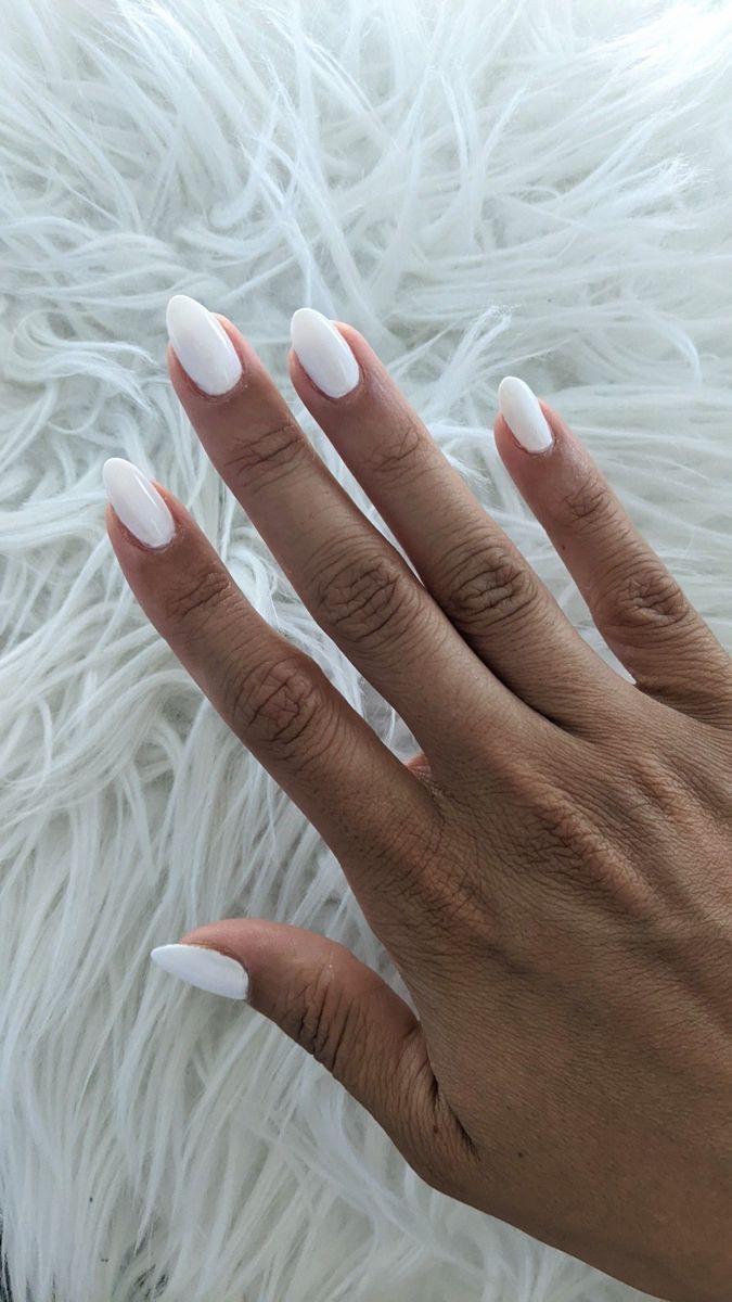 Chic Minimalism: Glossy White Almond-Shaped Nails for Any Occasion