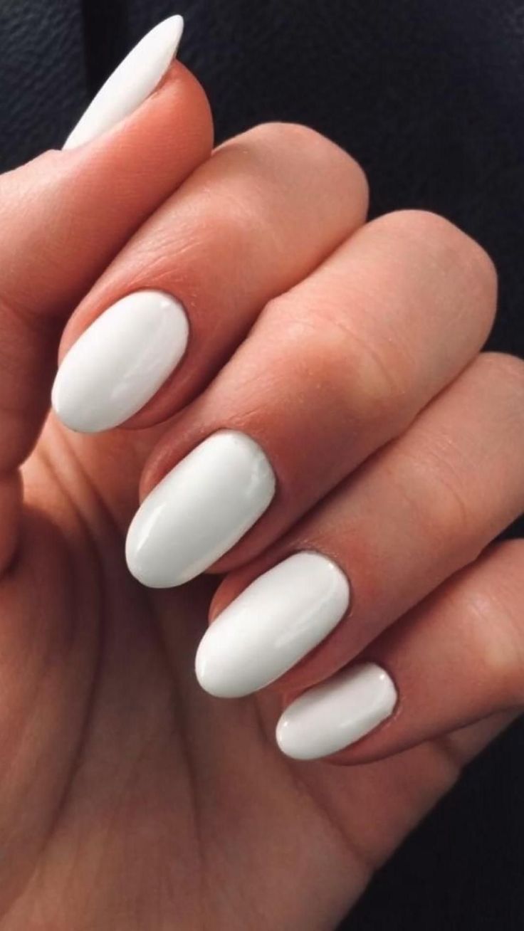 Elegant Glossy White Almond-Shaped Nails: Versatile for All Occasions and Art Ideas.