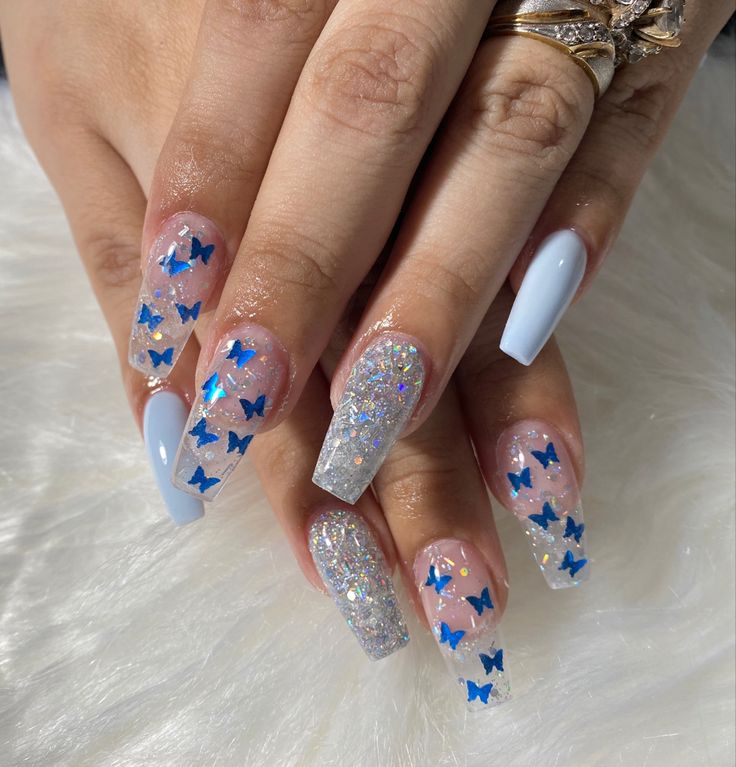 Whimsical Pastel Blue Butterfly Nail Design with Holographic Glitter and Silver Tips