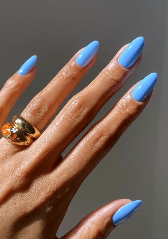 Sky-Blue Almond Nails: A Playful yet Sophisticated Seasonal Statement.