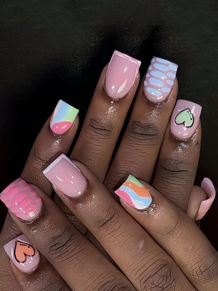 Vibrant Pastel Nail Art: Whimsical Patterns and Glossy Chic Finish.