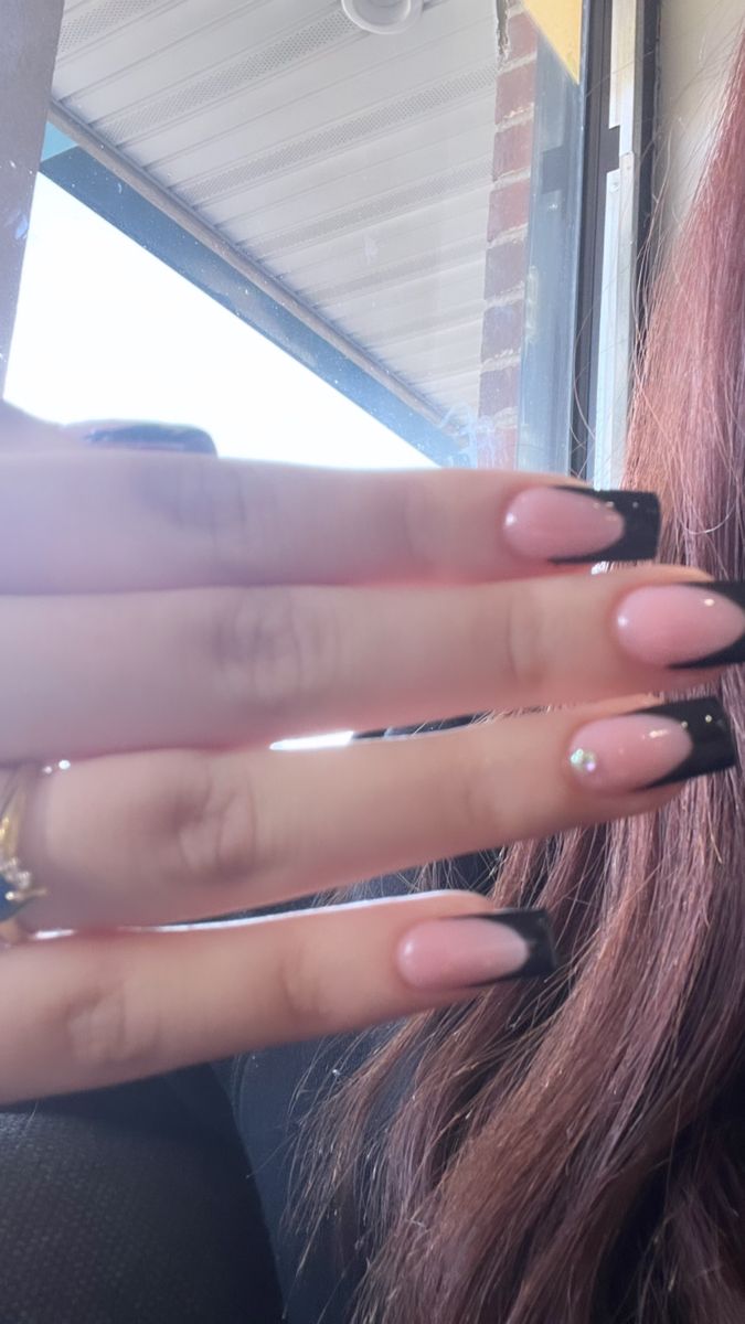 Chic Nail Design: Elegant Soft Pink and Bold Black with Rhinestone Accents