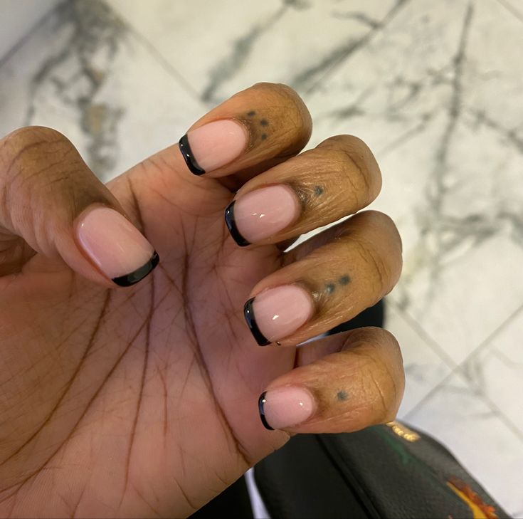 Sophisticated Chic: Elegant Nude Nails with Black French Tips