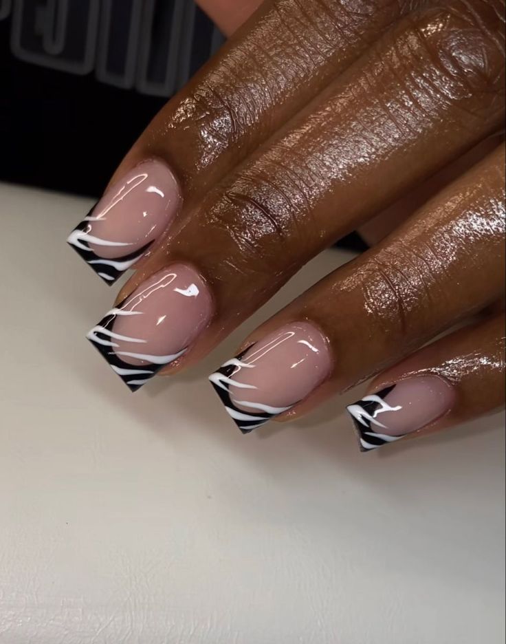 Chic Nail Design: Ombre Nude Base with Bold Zebra Stripes