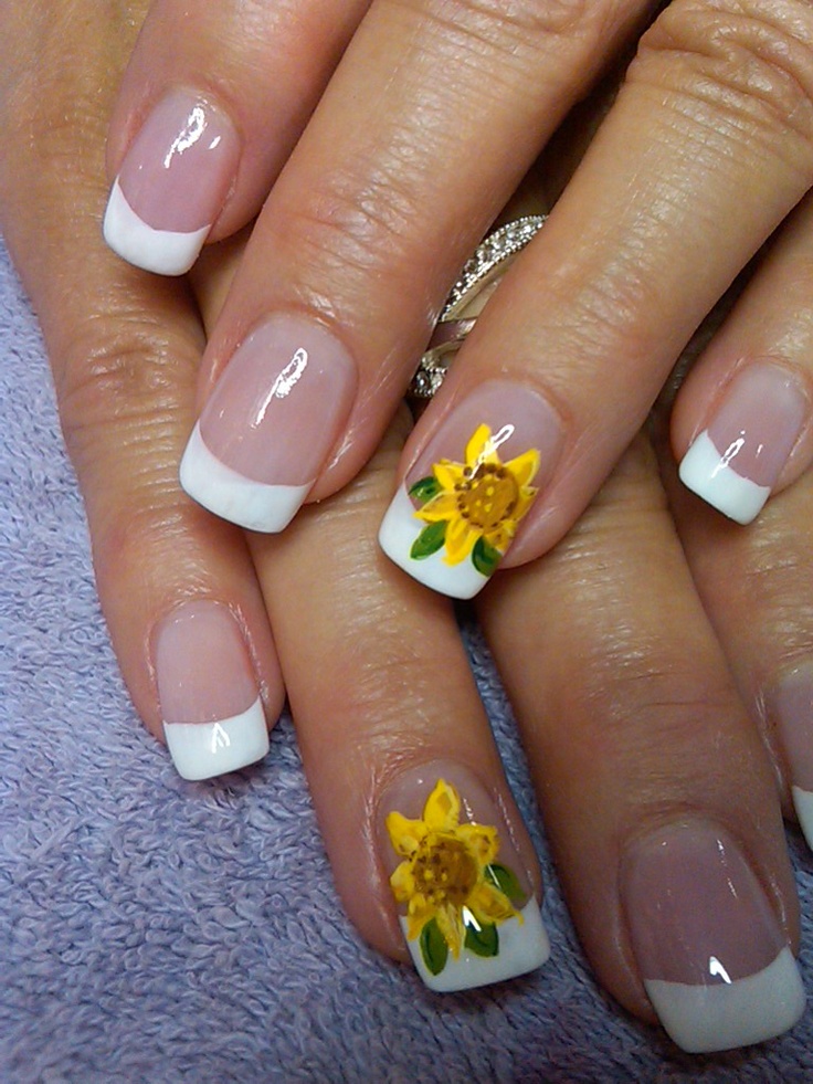 Chic French Manicure Enhanced by Vibrant Floral Artistry for a Fresh Look.