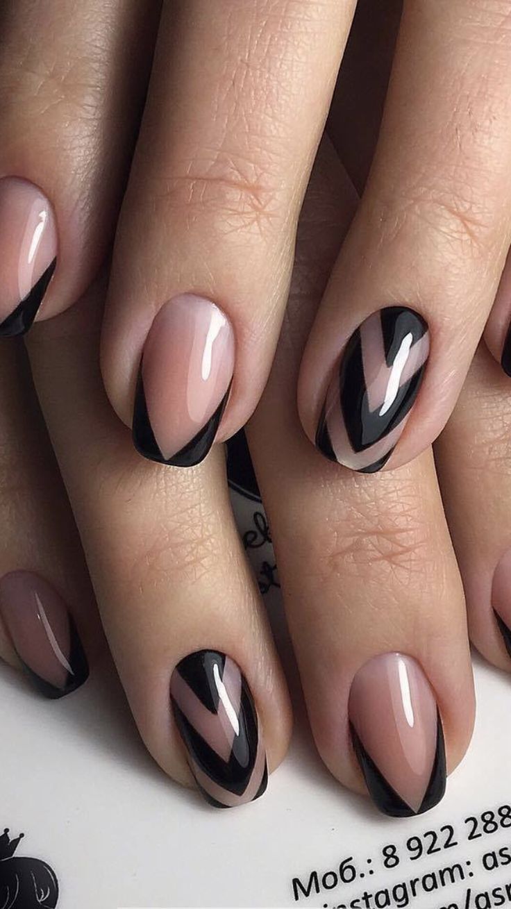 Chic Nude and Black Nail Design with Bold Geometric Patterns for a Modern, Edgy Elegance.