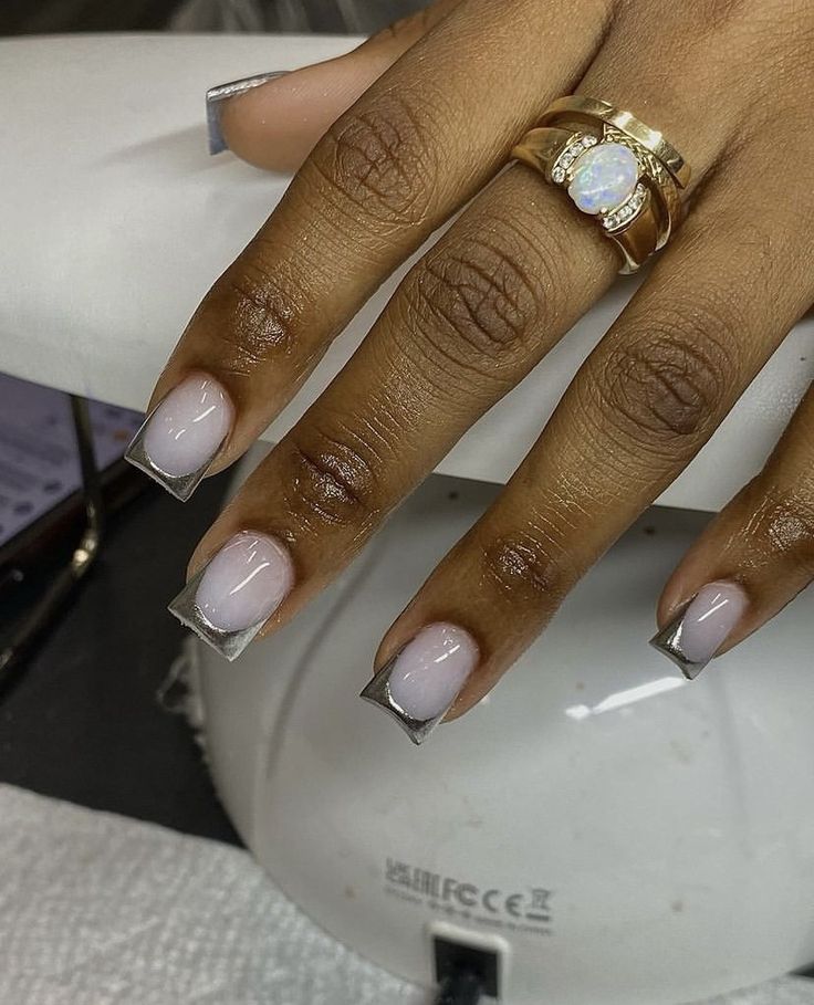 Chic Modern French Manicure: Soft Nude Base with Striking Silver Tips