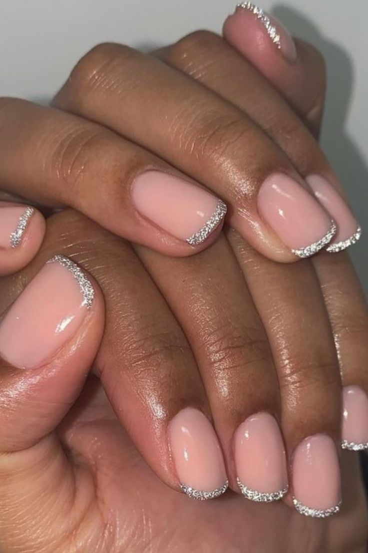 Chic Nude Base with Sparkling Silver Tips: An Elegant Nail Design for Any Occasion.