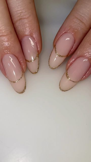 Sophisticated Nude Gradient Nail Design with Delicate Golden Tips.