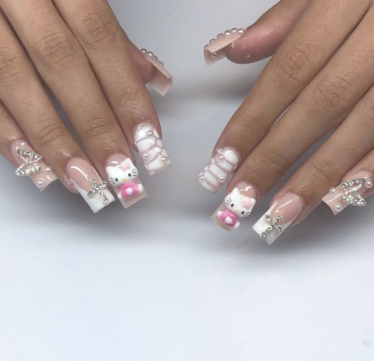 Charming Whimsical Nails: Soft Pink and White with Pearls, Bows, and Playful Cat Motifs