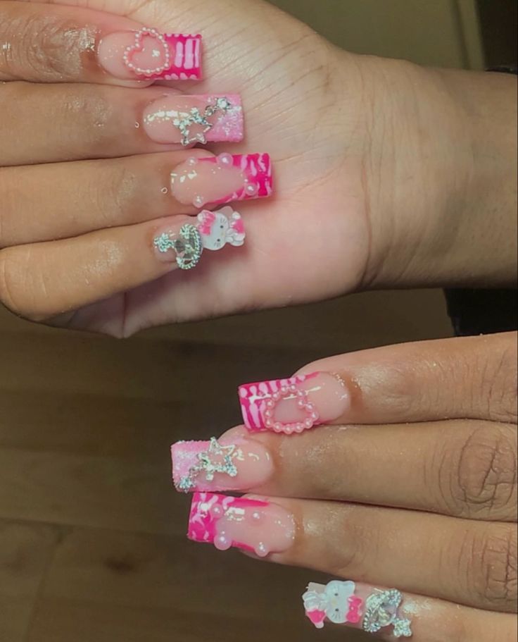 Playful Pink and White Square Nail Design with Sparkling Embellishments.