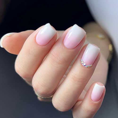 Elegant Ombre Nails with Rhinestone Accent for Glamorous Style.