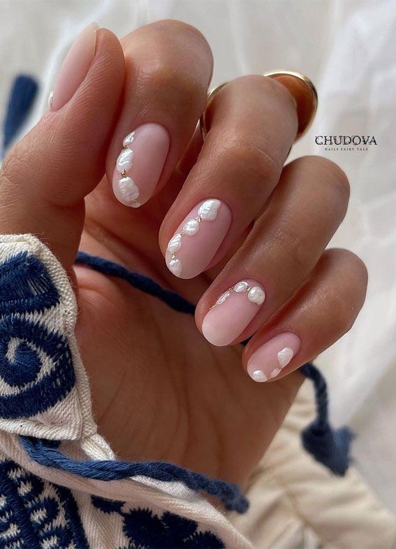 Elegant Blush Nail Design with Intricate Pearl-Like Accents