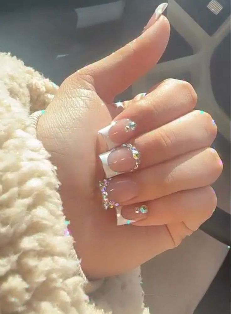 Chic French Tip Nail Design with Sparkling Rhinestones for Versatile Elegance.