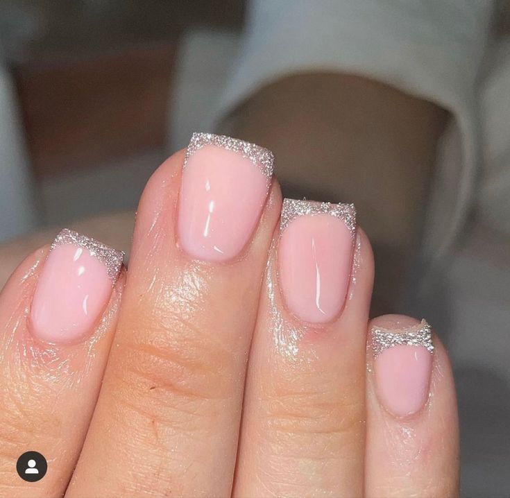 Elegant Pink Nails with Glittery Silver Tips: A Modern Twist on Classic French Manicure.