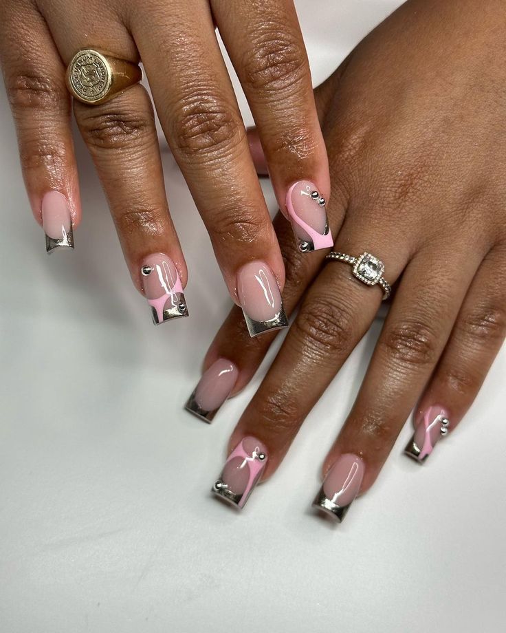 Chic Elegant Nail Design: Soft Pink, Clear Tips, and Sparkling Accents.