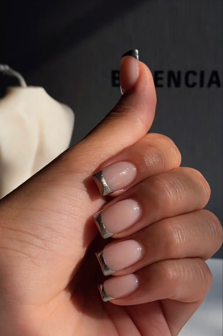 Chic Minimalist French Manicure with Soft Nude Base and Metallic Silver Tips.