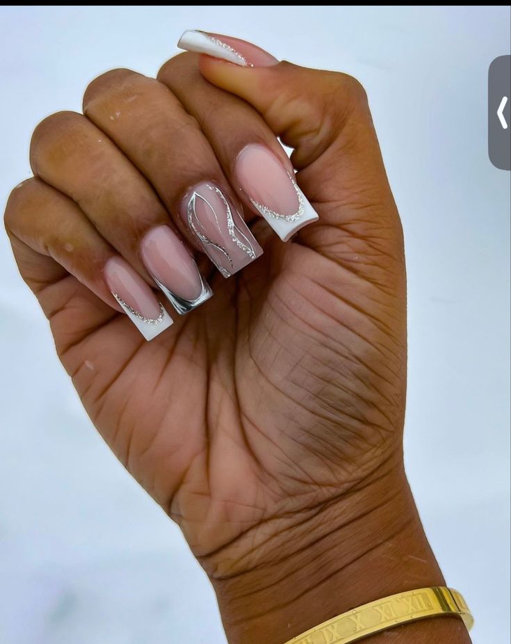 Sophisticated Nude French Tip Nail Design with Delicate Silver Accents.