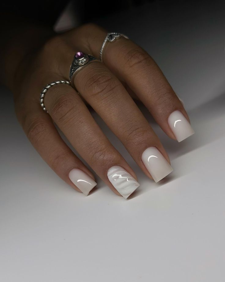 Elegant Nude Nail Design with Glossy Finish and Artistic White Accent Line.