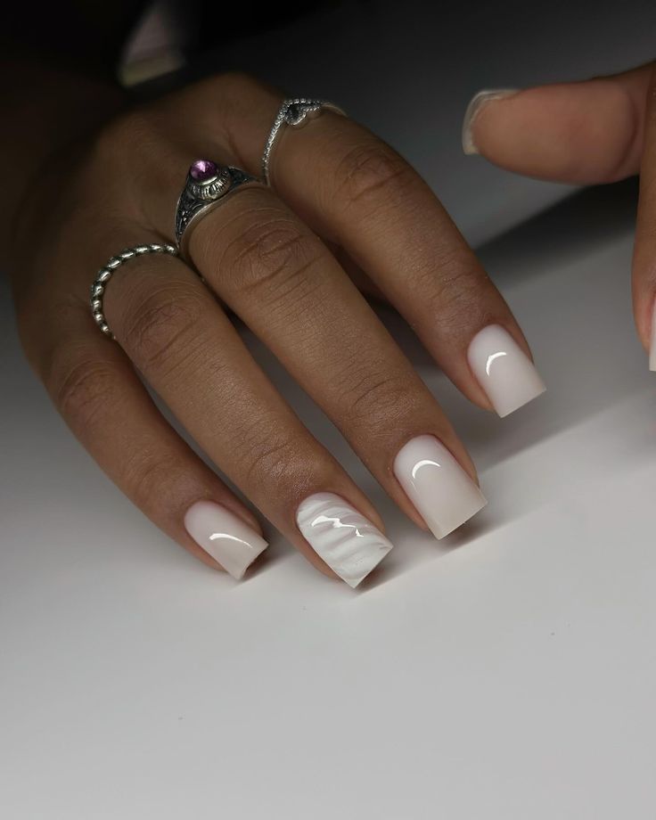 Chic Minimalist Nail Design with Glossy Nude Lacquer and Subtle Wavy Accent.