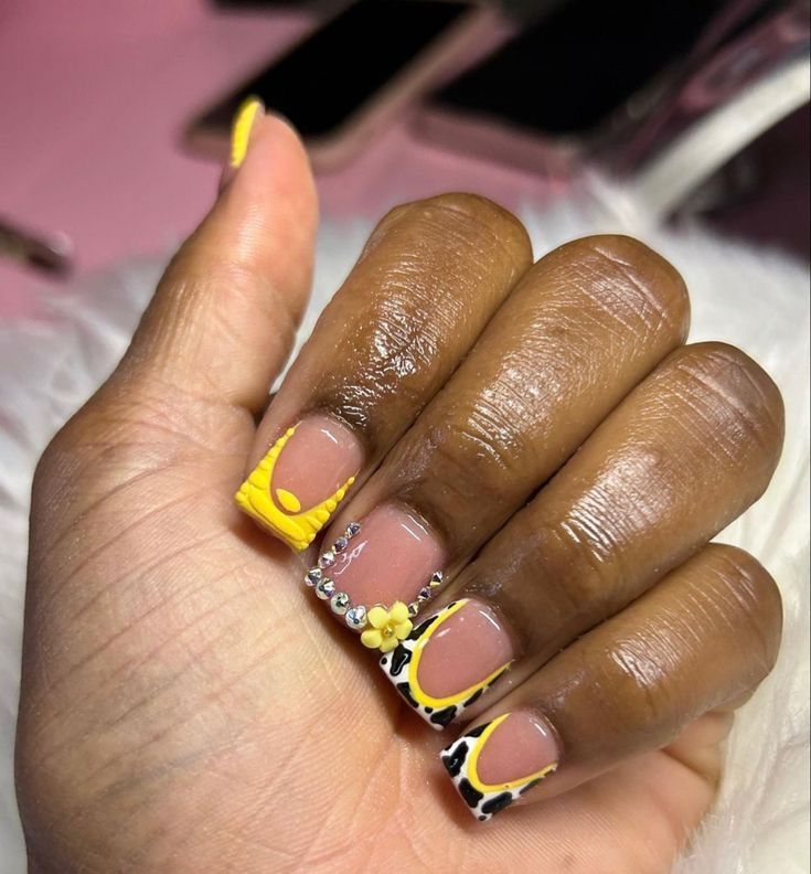 Bold Yellow and Animal Print Nail Design with Elegant Details