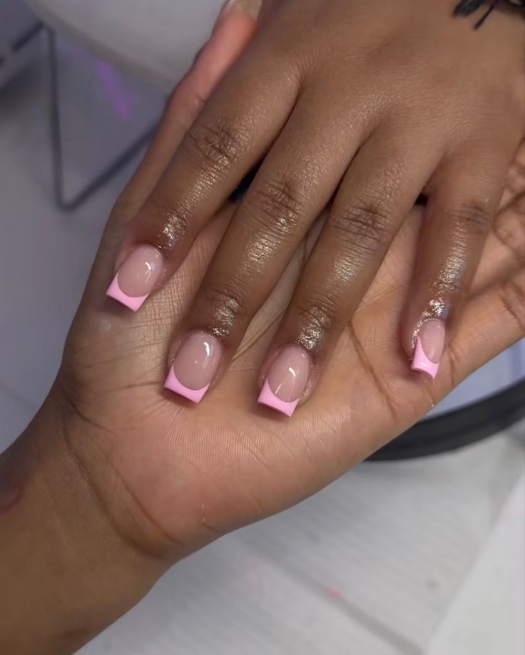 Chic Nude and Pink Nail Design with Subtle Embellishments for Any Occasion.