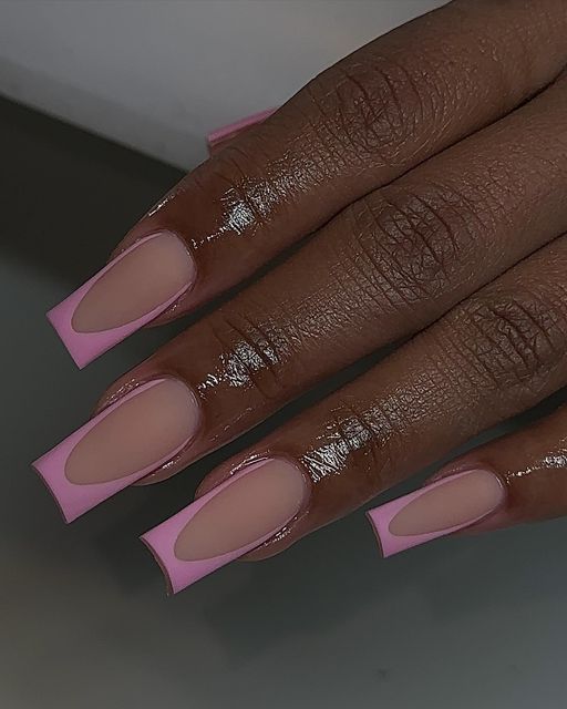 Chic Contemporary Nail Design: Soft Nudes with Bold Pink Tips for a Modern Aesthetic.