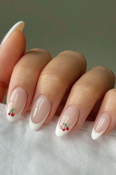 Charming Cherry-Embellished French Tip Manicure: A Sophisticated Blend of Elegance and Whimsy.