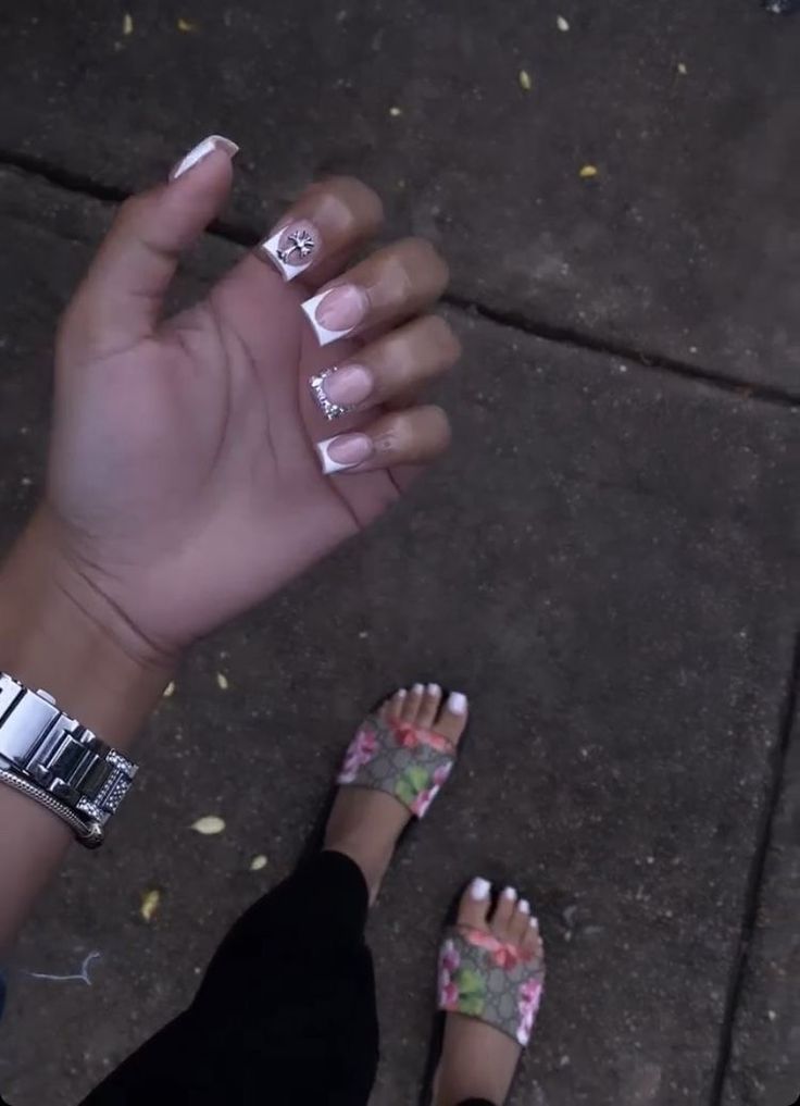 Chic French Manicure with Floral Accents and Casual Outfit for a Sophisticated Look