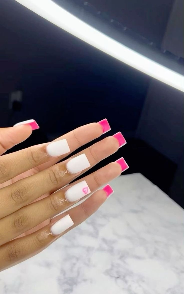 Chic Square Nails: White Base with Vibrant Pink Tips and Whimsical Heart Accent