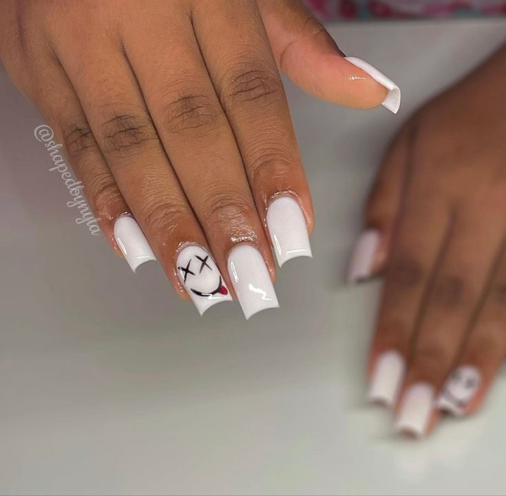 Trendy Manicure: Chic White Base with Playful Accents and Unique Graphic Elements.