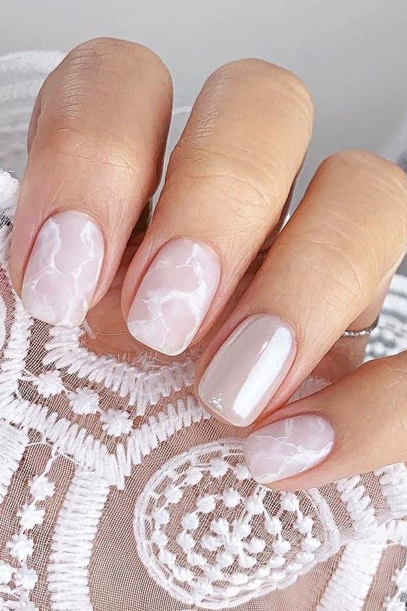 Chic Marble-Patterned Nails with Soft Pink and White Swirls