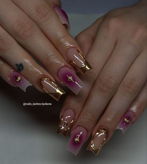 Chic Gradient Nail Design with Gold Foil and Star Accents.