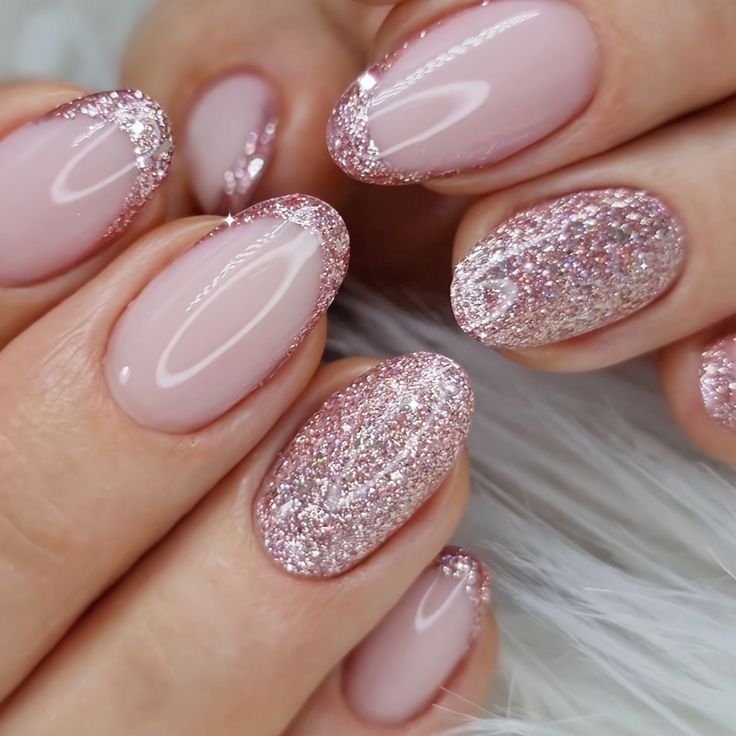 Elegant Glittering Ombre Nails with Soft Pink Base and Rose Gold Accents