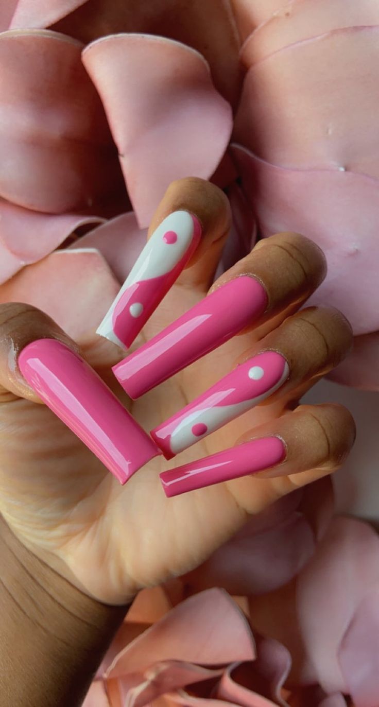 Playful Pink Nail Design: Glossy Finish with Dots and Accents for a Bold Aesthetic.