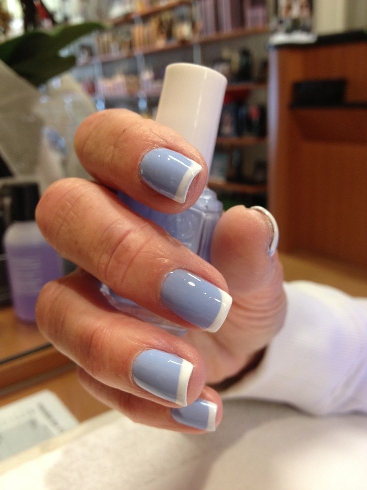 Chic French Manicure: Soft Blue Base with Elegant White Tips for a Timeless yet Playful Look.