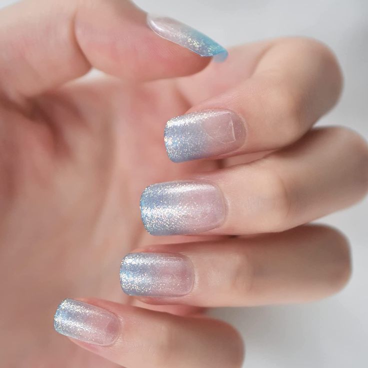 Elegant Shimmering Gradient Nails in Soft Blues and Silvers.