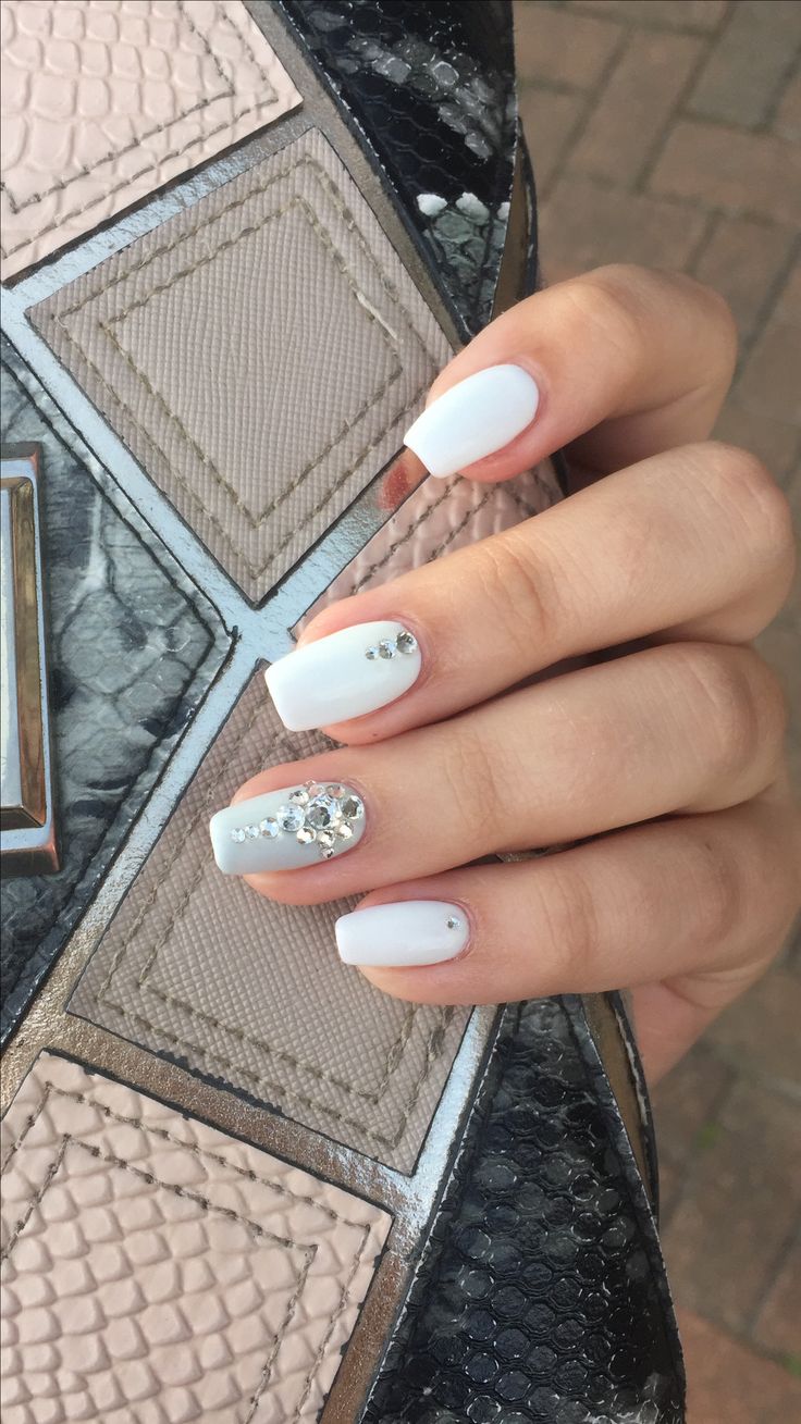 Chic Elegant White Manicure with Matte, Glossy Finishes and Sparkling Rhinestones.