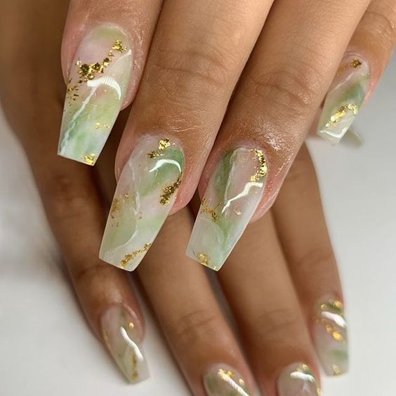 Elegant Translucent Marble-Inspired Nails with Soft Green, White Swirls, and Gold Flakes.