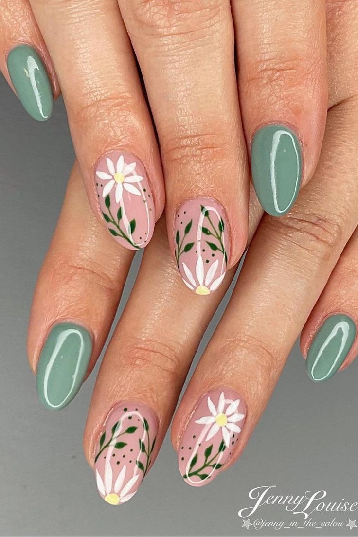 Delicate Daisy Floral Nail Design with Soft Pink Background and Deep Green Accents for Spring/Summer.