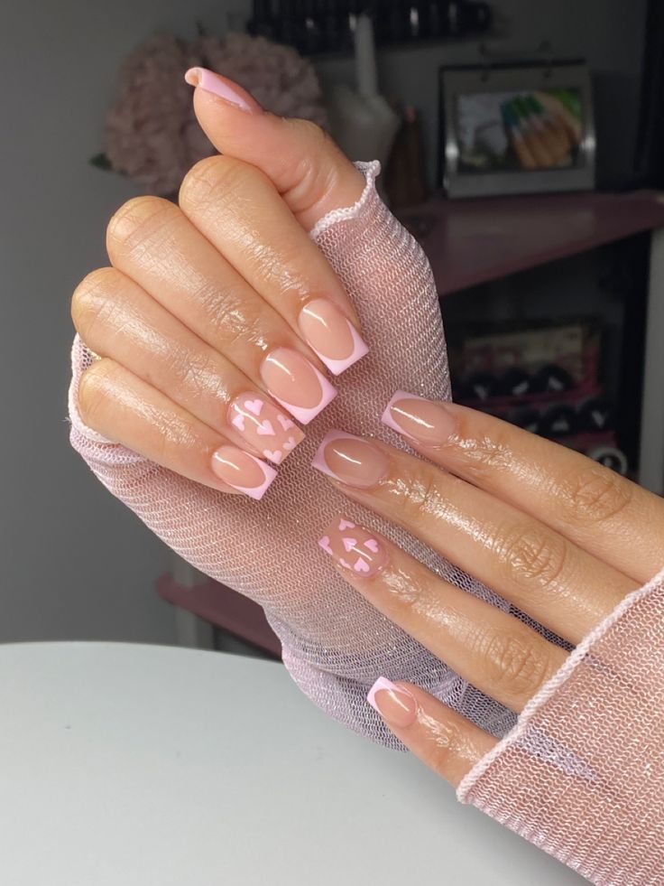 Chic Nude & Pink French Tip Nail Design with Playful Geometric Accents.