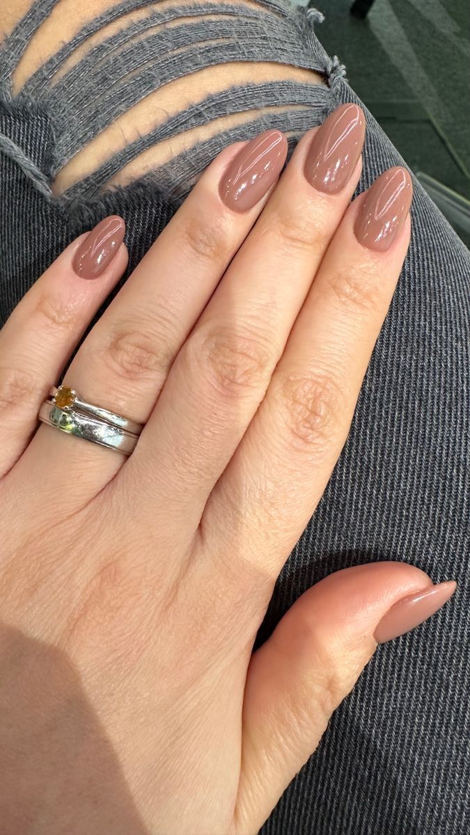 Chic Almond-Shaped Nails in Warm Taupe: A Sophisticated Look for Any Occasion.