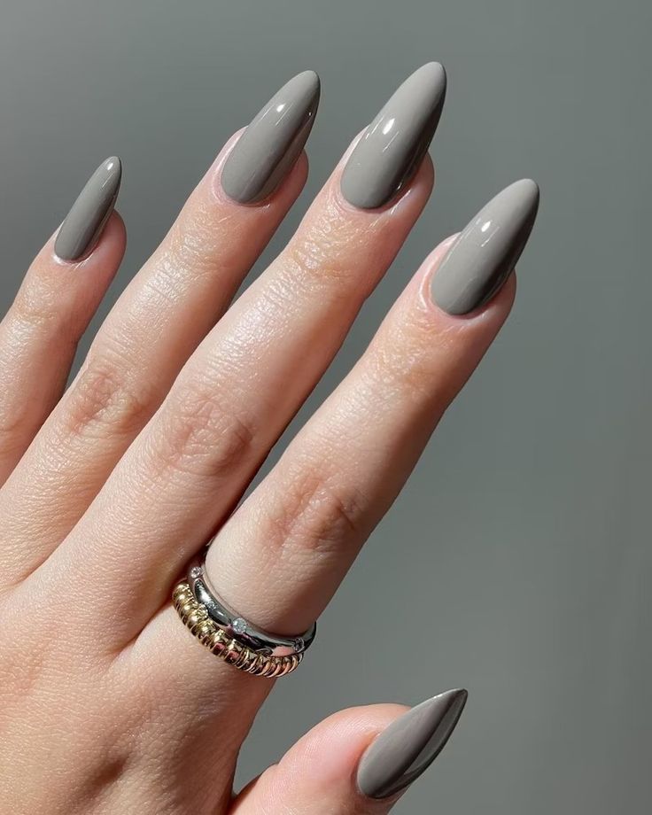 Sophisticated Almond-Shaped Nails with Chic Gray Polish for a Modern Timeless Look.