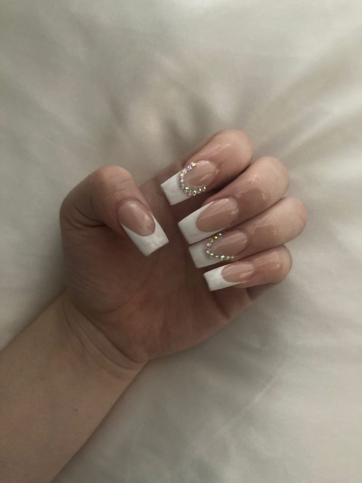 Chic French Manicure with Rhinestones: A Sophisticated Modern Twist.