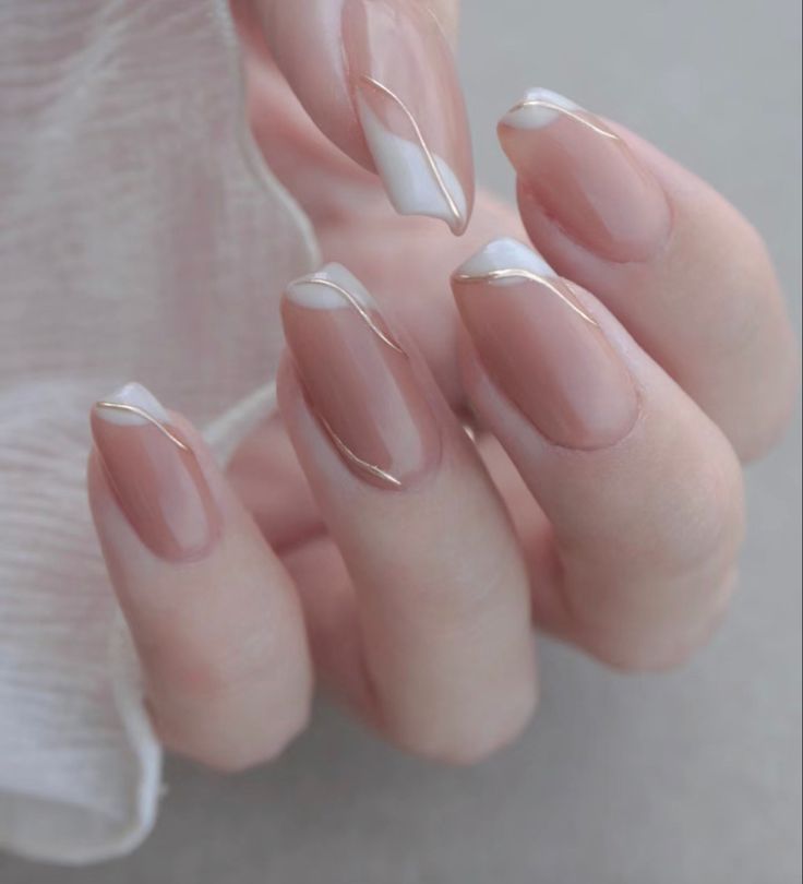 Elegant French Manicure with Wavy Lines and Subtle Gold Accents.